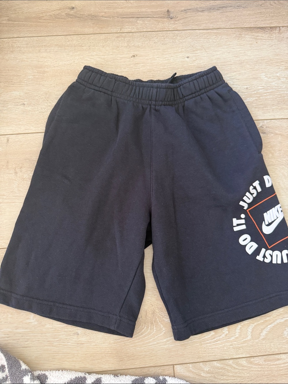 Nike Black Shorts with White and Orange Logo
